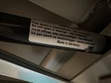 a sign on the ceiling of a subway train