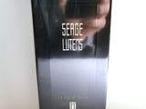 an image of a box of perfume sitting on top of a table