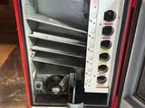 a red and black oven with a fan inside of it