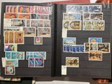 a book with stamps on the pages and a book with stamps on the pages