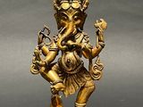 an image of a statue of an elephant with a bird on its back
