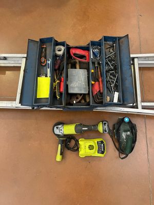 a tool box that has tools in it on the floor
