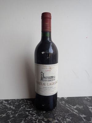 a bottle of wine that is sitting on a table
