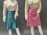 two mannequins dressed in different colors of clothing