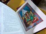 an open book with a picture of a man and a woman