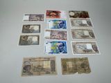 several different types of paper money laid out on a table