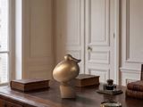 a vase sitting on a desk in a room