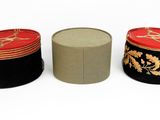 three hats that are sitting next to each other on a table