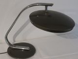 a black lamp that is on a white table