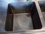 a picture of a stainless steel kitchen sink with a drain