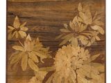 an image of a close up of a painting of flowers on a wooden surface