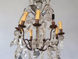 a close up of a chandelier hanging from a ceiling