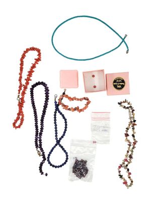 a lot of items that are laying out on a white surface