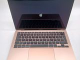 an apple macbook pro laptop computer sitting on top of a white table