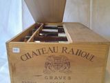 a wooden box with a bottle of wine inside of it