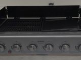 an image of a bbq grill in a garage