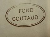a sign that says fond coutaud on the side of a wall