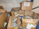 a pile of boxes with remotes on top of them