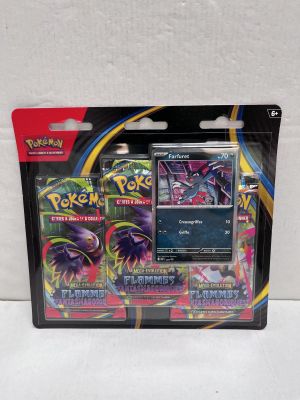 a close up of a package of pokemon cards on a white surface