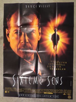 an old movie poster of a man with a cigarette in his mouth