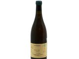 the bottle of wine is empty on a white surface