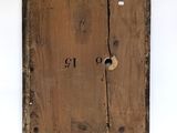 an old wooden box with a hole in the middle of it