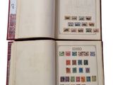 a book with stamps on the pages and a book with stamps on the pages