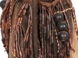 an image of a close up of a wooden object with beads on it