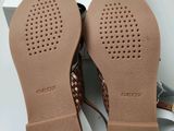 a close up of a pair of shoes in a box