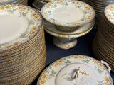 a lot of plates and bowls that are sitting on a table