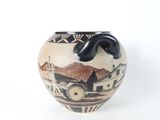 a vase with a picture of a town on it