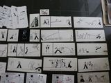 a lot of drawings on the floor of this room