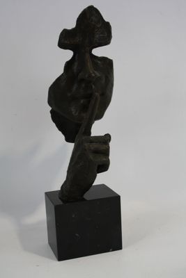 statue of a woman with a hat on her head and a hand on her hip