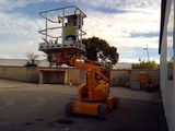 an image of a man on a scissor in a parking lot