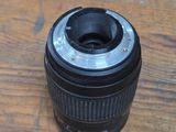 a camera lens sitting on a wooden table