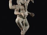 an image of a statue of a woman holding a snake