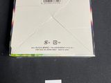 an image of a white envelope with a sticker on it and a price tag attached to it