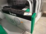 a stack of clothes on a shelf in a store