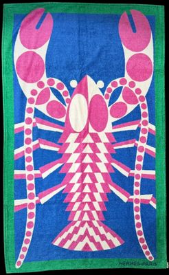a close up of a towel with a lobster on it