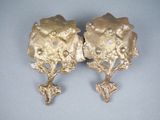 pair of gold plated earrings with flowers and leaves on them