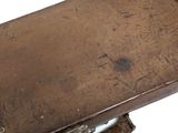 an old suitcase with a leather strap on it