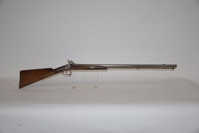 a gun that is sitting on top of a table