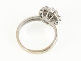 a close up of a diamond ring on a white background