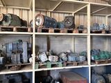 many different types of machinery on the shelves in this warehouse