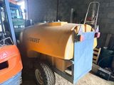 a forklift truck parked next to a forklift truck in a building