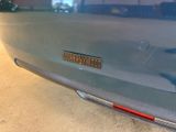 a close up of a car ' s bumper with a sticker on it