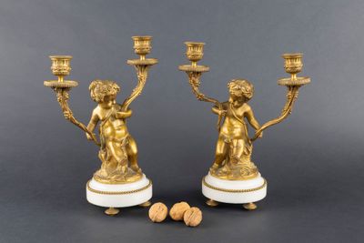 pair of antique brass candlesticks on marble bases with cherenshes