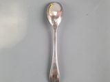 a spoon that is sitting on top of a table