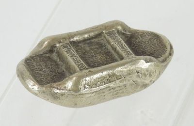 a small silver object that is on a table