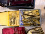 many different types of knives and knives in a box